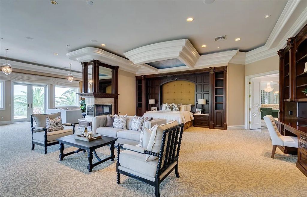 8920 Players Club Drive, Las Vegas, Nevada is a sprawling estate designed for entertaining on a grand scale with soaring ceiling heights, expansive entry, and ornate marble and carpet floor patterns.