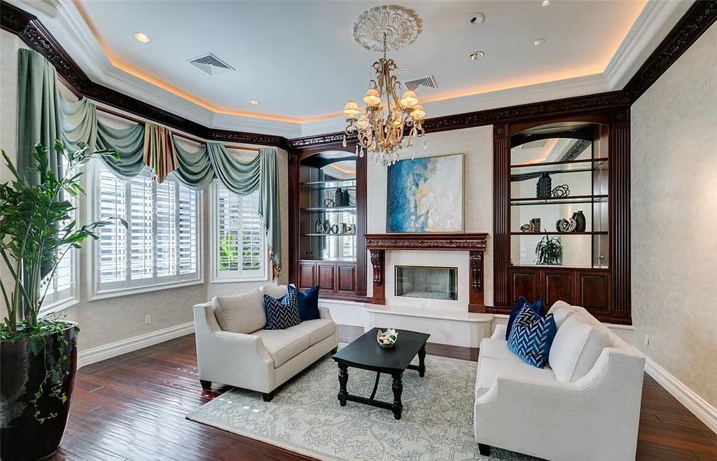 8920 Players Club Drive, Las Vegas, Nevada is a sprawling estate designed for entertaining on a grand scale with soaring ceiling heights, expansive entry, and ornate marble and carpet floor patterns.