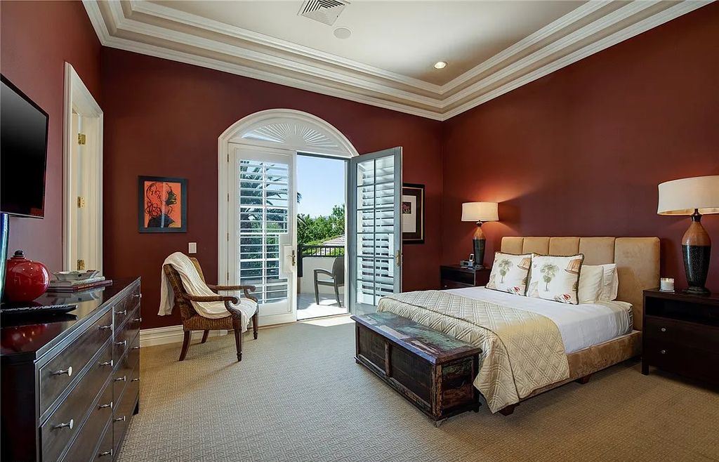 8920 Players Club Drive, Las Vegas, Nevada is a sprawling estate designed for entertaining on a grand scale with soaring ceiling heights, expansive entry, and ornate marble and carpet floor patterns.