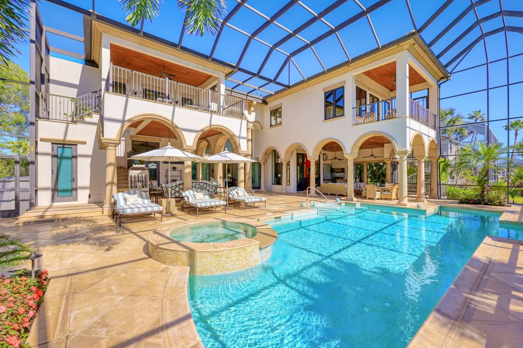 1450 Gulfstar Drive South, Naples, Florida is an impressive home combining the ultimate in interior finishes and exterior amenities, over 4,800 square feet of outdoor living area, unmatched design and exquisite finishes throughout.