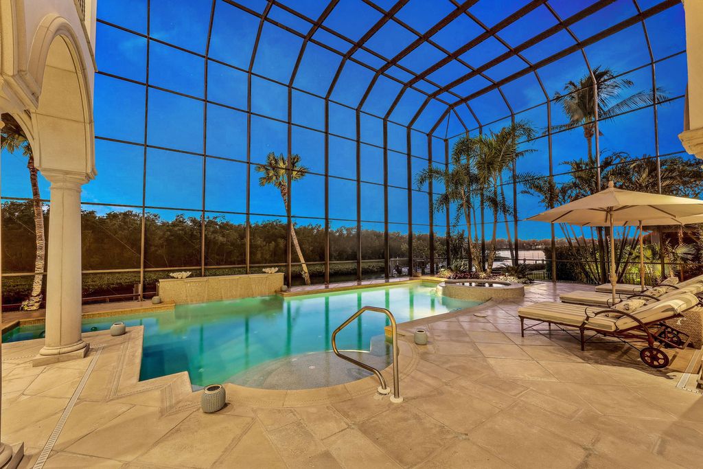 1450 Gulfstar Drive South, Naples, Florida is an impressive home combining the ultimate in interior finishes and exterior amenities, over 4,800 square feet of outdoor living area, unmatched design and exquisite finishes throughout.