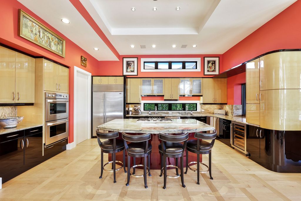 1450 Gulfstar Drive South, Naples, Florida is an impressive home combining the ultimate in interior finishes and exterior amenities, over 4,800 square feet of outdoor living area, unmatched design and exquisite finishes throughout.