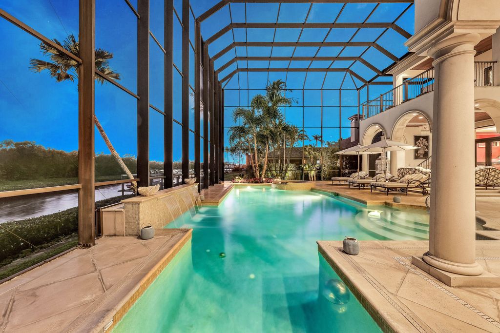 1450 Gulfstar Drive South, Naples, Florida is an impressive home combining the ultimate in interior finishes and exterior amenities, over 4,800 square feet of outdoor living area, unmatched design and exquisite finishes throughout.