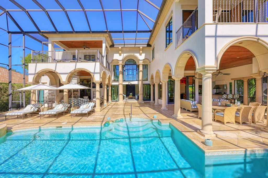 1450 Gulfstar Drive South, Naples, Florida is an impressive home combining the ultimate in interior finishes and exterior amenities, over 4,800 square feet of outdoor living area, unmatched design and exquisite finishes throughout.