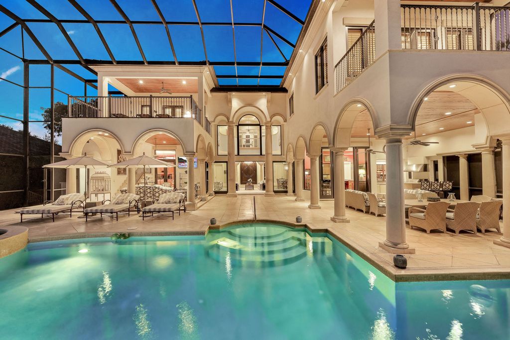 1450 Gulfstar Drive South, Naples, Florida is an impressive home combining the ultimate in interior finishes and exterior amenities, over 4,800 square feet of outdoor living area, unmatched design and exquisite finishes throughout.