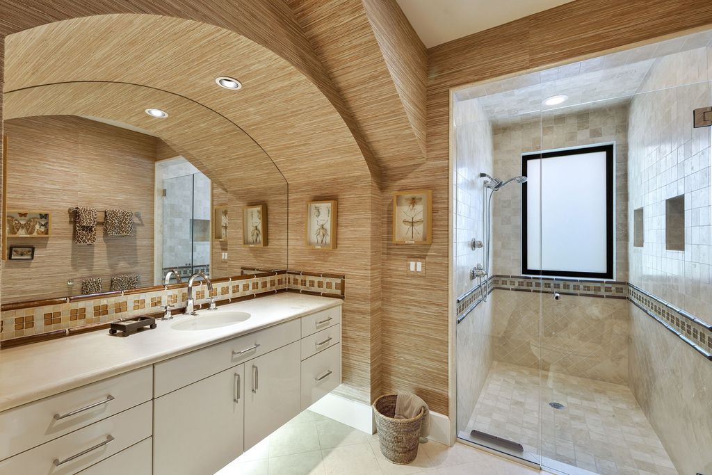 1450 Gulfstar Drive South, Naples, Florida is an impressive home combining the ultimate in interior finishes and exterior amenities, over 4,800 square feet of outdoor living area, unmatched design and exquisite finishes throughout.
