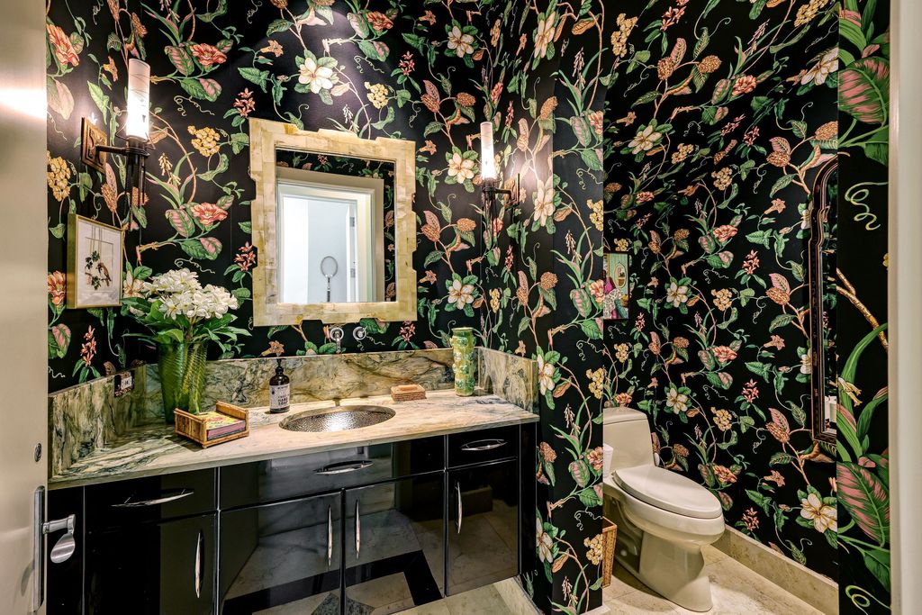 1450 Gulfstar Drive South, Naples, Florida is an impressive home combining the ultimate in interior finishes and exterior amenities, over 4,800 square feet of outdoor living area, unmatched design and exquisite finishes throughout.