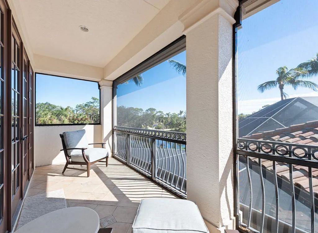 26079 Fawnwood Court, Bonita Springs, Florida, is a beautiful lakefront home built on a prominent corner lot in desirable Spring Ridge. With warm and inviting décor and a separate waterfall flowing into a tropical lagoon pool, it is a timeless design.