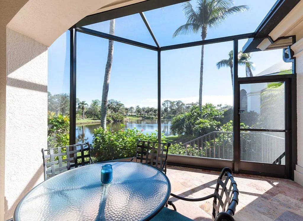 26079 Fawnwood Court, Bonita Springs, Florida, is a beautiful lakefront home built on a prominent corner lot in desirable Spring Ridge. With warm and inviting décor and a separate waterfall flowing into a tropical lagoon pool, it is a timeless design.