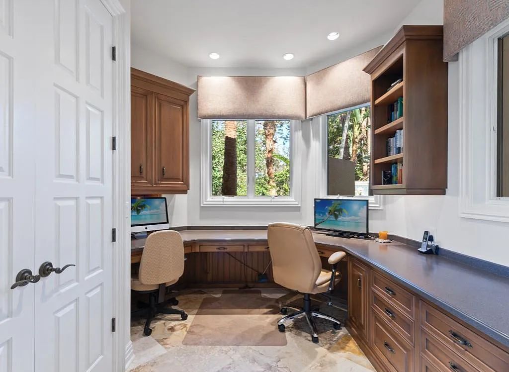 26079 Fawnwood Court, Bonita Springs, Florida, is a beautiful lakefront home built on a prominent corner lot in desirable Spring Ridge. With warm and inviting décor and a separate waterfall flowing into a tropical lagoon pool, it is a timeless design.