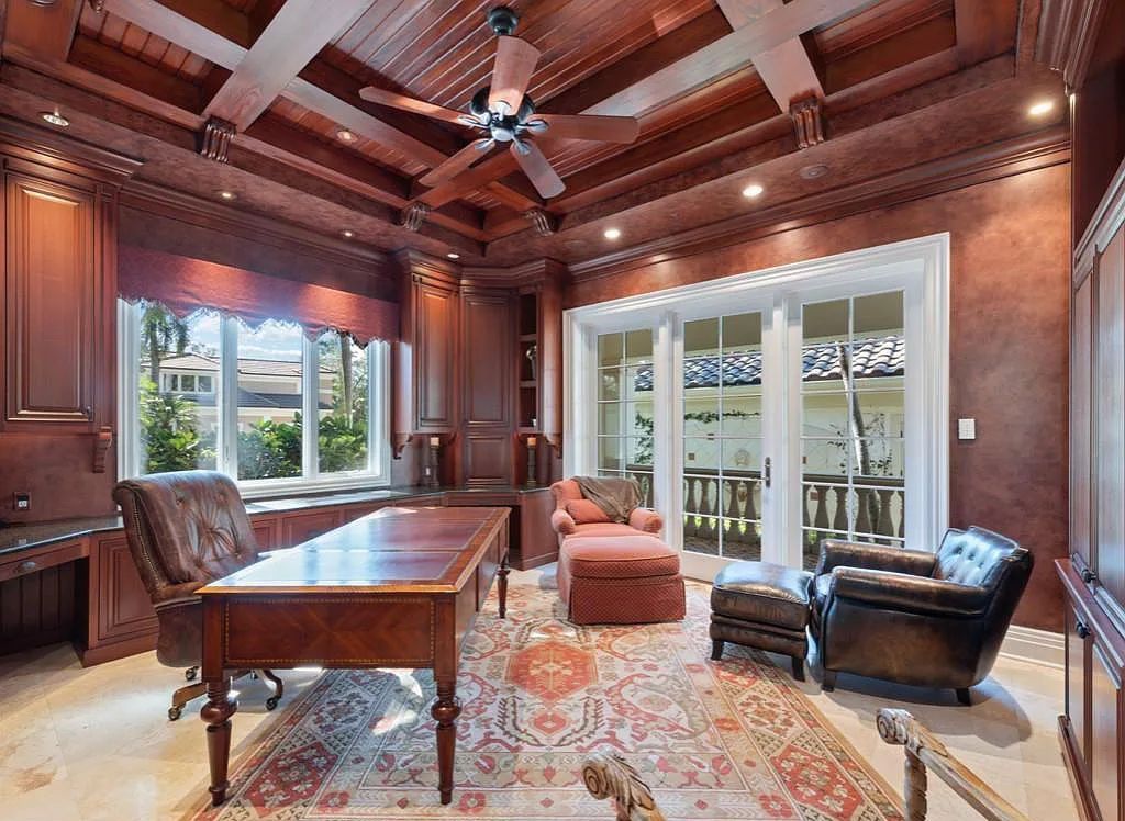 26079 Fawnwood Court, Bonita Springs, Florida, is a beautiful lakefront home built on a prominent corner lot in desirable Spring Ridge. With warm and inviting décor and a separate waterfall flowing into a tropical lagoon pool, it is a timeless design.