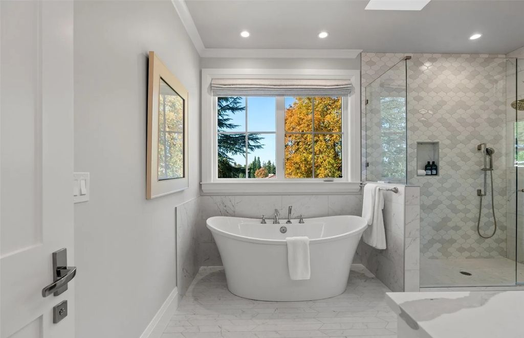 The Home in Bellevue was custom built in 2021 with high-end finishes and modern amenities, now available for sale. This home located at 9563 NE 1st Street, Bellevue, Washington