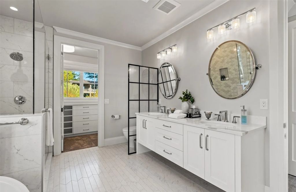 The Home in Bellevue was custom built in 2021 with high-end finishes and modern amenities, now available for sale. This home located at 9563 NE 1st Street, Bellevue, Washington