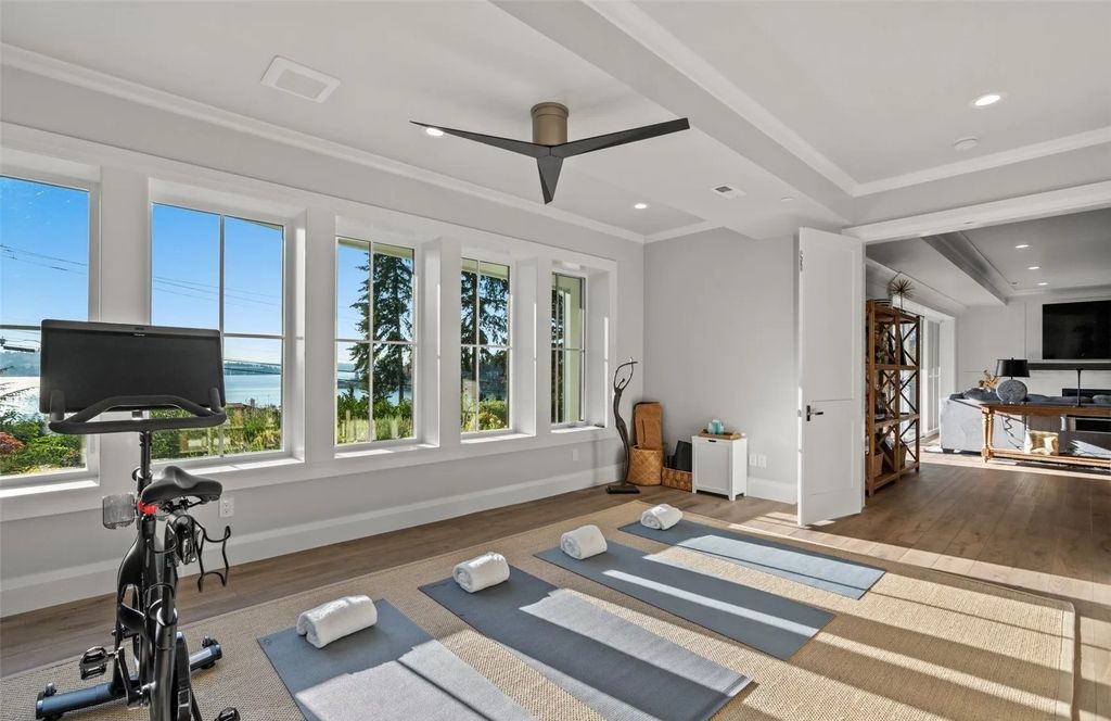 The Home in Bellevue was custom built in 2021 with high-end finishes and modern amenities, now available for sale. This home located at 9563 NE 1st Street, Bellevue, Washington