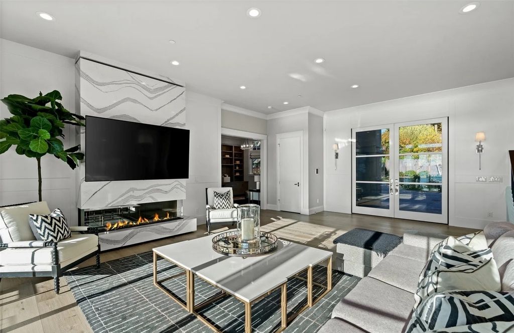 The Home in Bellevue was custom built in 2021 with high-end finishes and modern amenities, now available for sale. This home located at 9563 NE 1st Street, Bellevue, Washington