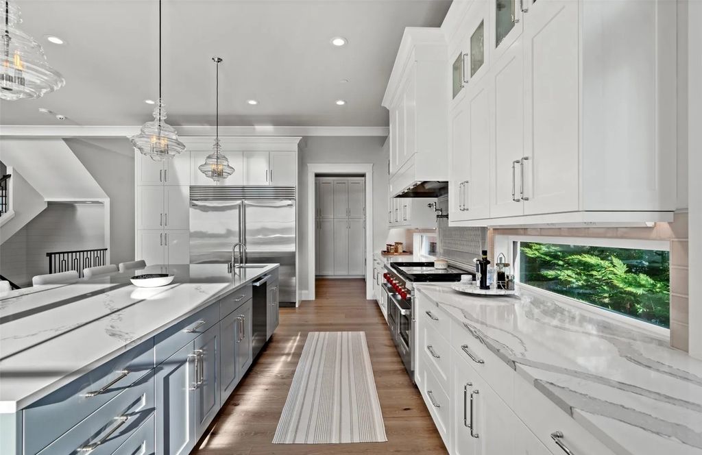 The Home in Bellevue was custom built in 2021 with high-end finishes and modern amenities, now available for sale. This home located at 9563 NE 1st Street, Bellevue, Washington