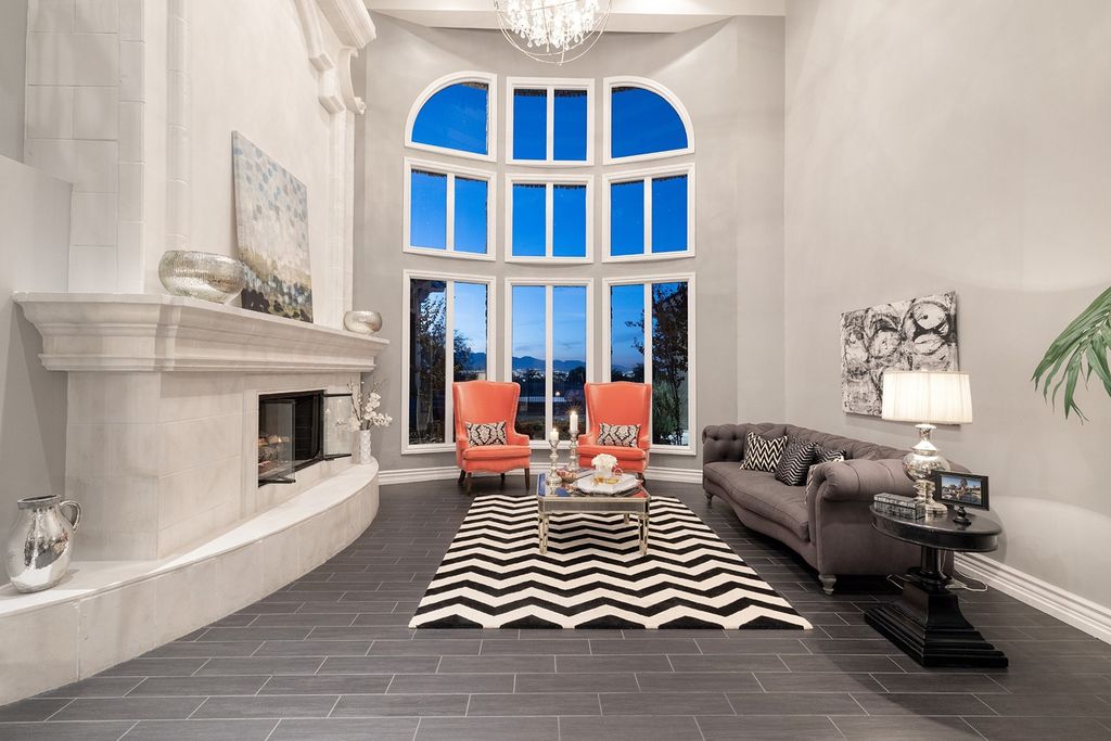 1513 Villa Rica Drive, Henderson, Nevada is a chic home in the Estates in Seven Hills with resort amenities including indoor-outdoor bar, movie theater, smart home, entertainers kitchen, bar seating, chic mirrored backsplash and more.