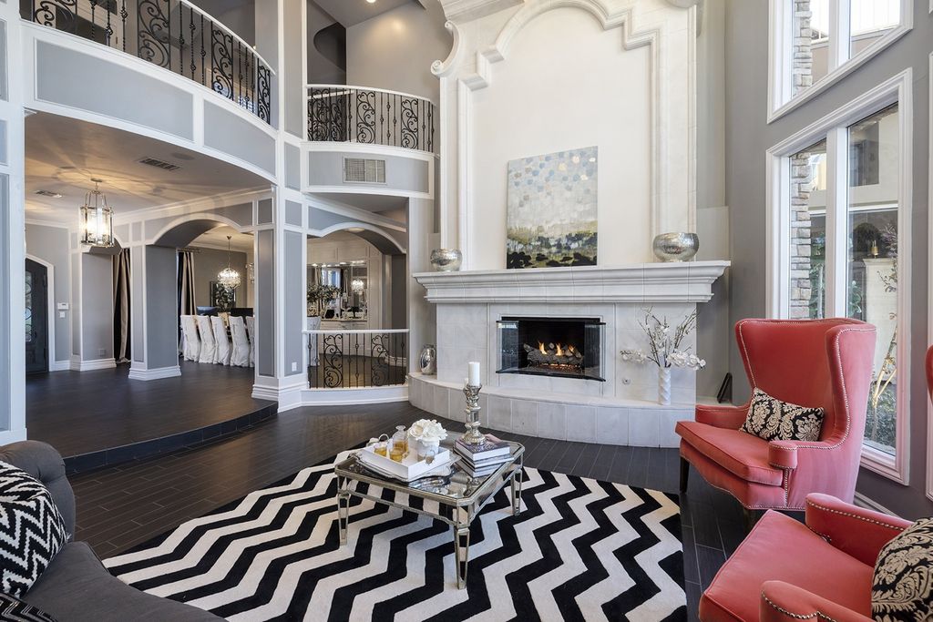 1513 Villa Rica Drive, Henderson, Nevada is a chic home in the Estates in Seven Hills with resort amenities including indoor-outdoor bar, movie theater, smart home, entertainers kitchen, bar seating, chic mirrored backsplash and more.