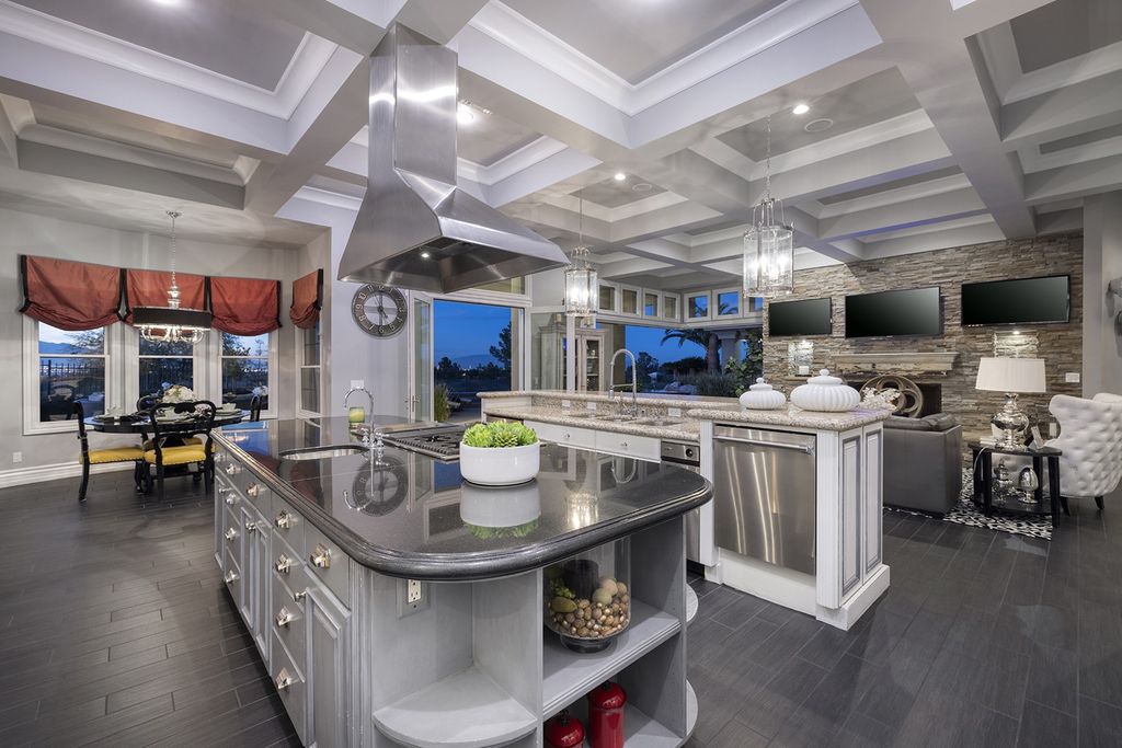 1513 Villa Rica Drive, Henderson, Nevada is a chic home in the Estates in Seven Hills with resort amenities including indoor-outdoor bar, movie theater, smart home, entertainers kitchen, bar seating, chic mirrored backsplash and more.