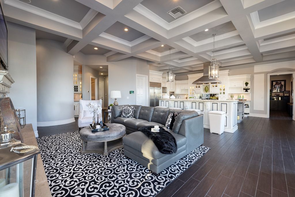 1513 Villa Rica Drive, Henderson, Nevada is a chic home in the Estates in Seven Hills with resort amenities including indoor-outdoor bar, movie theater, smart home, entertainers kitchen, bar seating, chic mirrored backsplash and more.