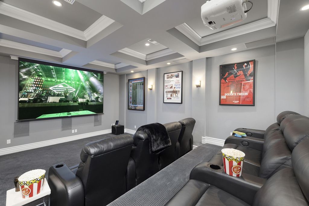 1513 Villa Rica Drive, Henderson, Nevada is a chic home in the Estates in Seven Hills with resort amenities including indoor-outdoor bar, movie theater, smart home, entertainers kitchen, bar seating, chic mirrored backsplash and more.