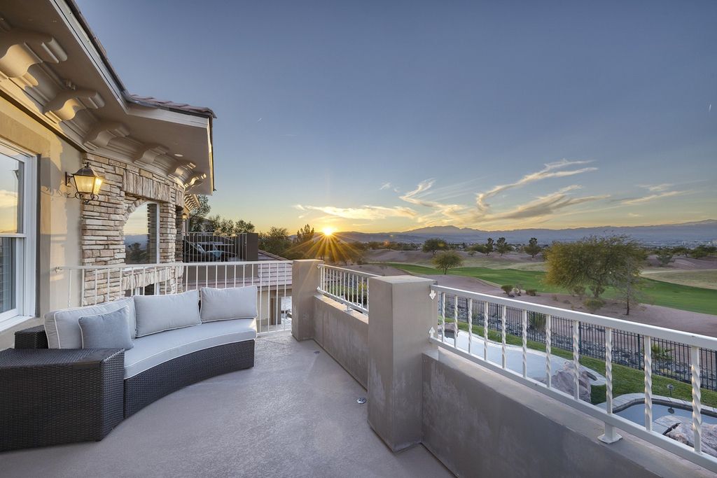 1513 Villa Rica Drive, Henderson, Nevada is a chic home in the Estates in Seven Hills with resort amenities including indoor-outdoor bar, movie theater, smart home, entertainers kitchen, bar seating, chic mirrored backsplash and more.