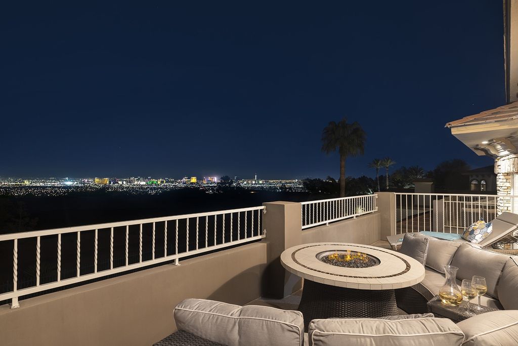 1513 Villa Rica Drive, Henderson, Nevada is a chic home in the Estates in Seven Hills with resort amenities including indoor-outdoor bar, movie theater, smart home, entertainers kitchen, bar seating, chic mirrored backsplash and more.