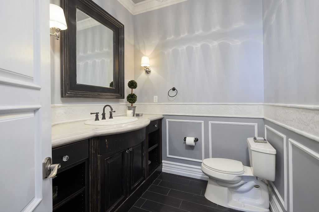 1513 Villa Rica Drive, Henderson, Nevada is a chic home in the Estates in Seven Hills with resort amenities including indoor-outdoor bar, movie theater, smart home, entertainers kitchen, bar seating, chic mirrored backsplash and more.