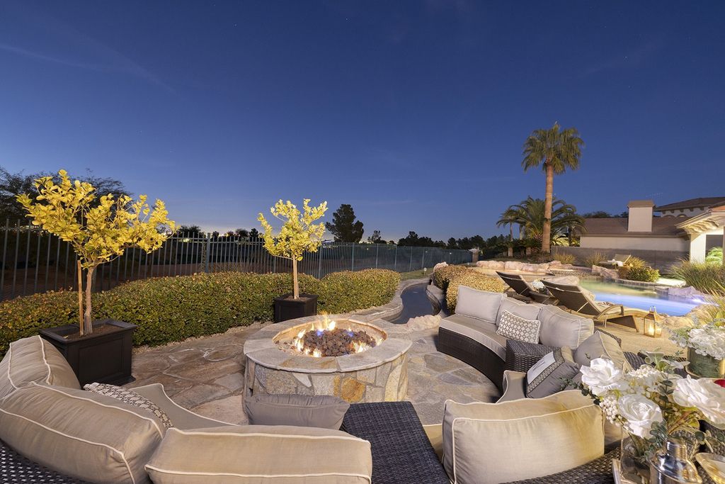 1513 Villa Rica Drive, Henderson, Nevada is a chic home in the Estates in Seven Hills with resort amenities including indoor-outdoor bar, movie theater, smart home, entertainers kitchen, bar seating, chic mirrored backsplash and more.