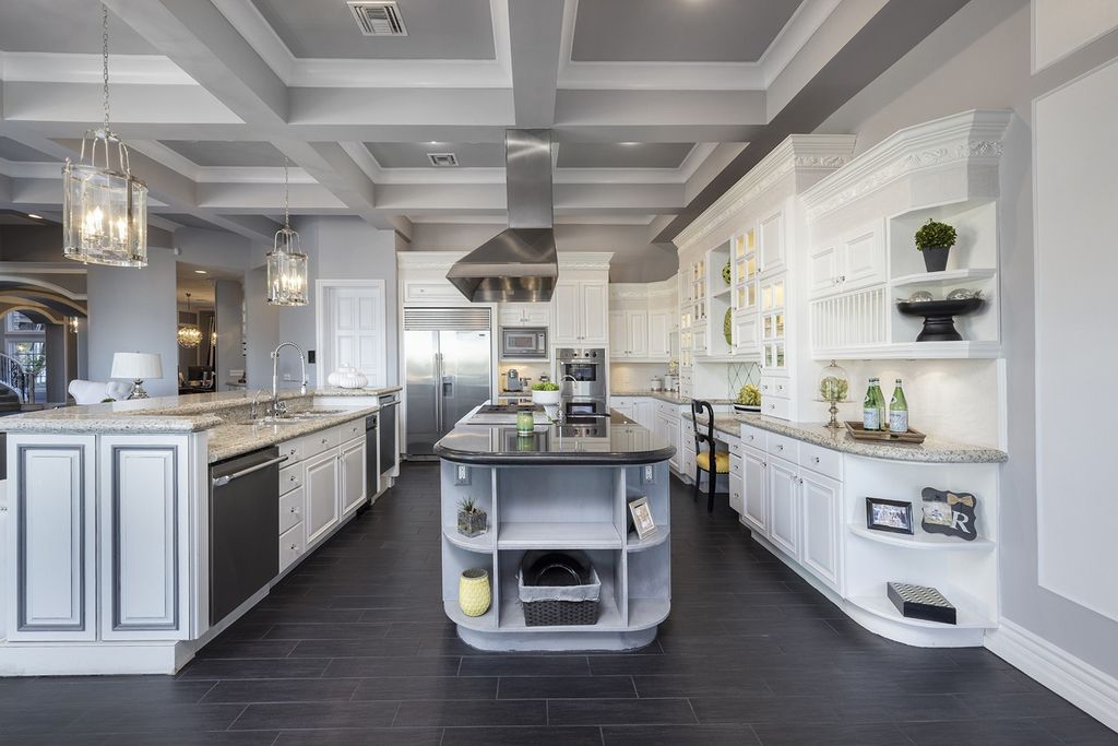 1513 Villa Rica Drive, Henderson, Nevada is a chic home in the Estates in Seven Hills with resort amenities including indoor-outdoor bar, movie theater, smart home, entertainers kitchen, bar seating, chic mirrored backsplash and more.