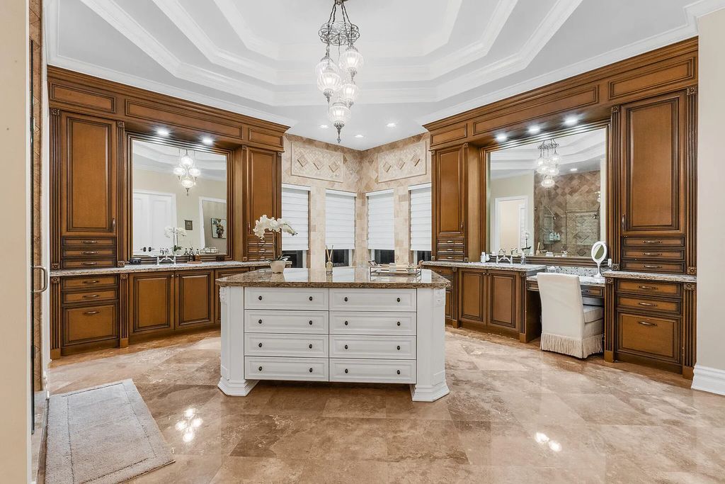 6030 Le Lac Road, Boca Raton, Florida, designed by award-winning architect Randall Stofft, is an exquisite lakefront estate located on 2.13 acres of meticulously manicured grounds within Boca Raton's most prestigious neighborhoods.