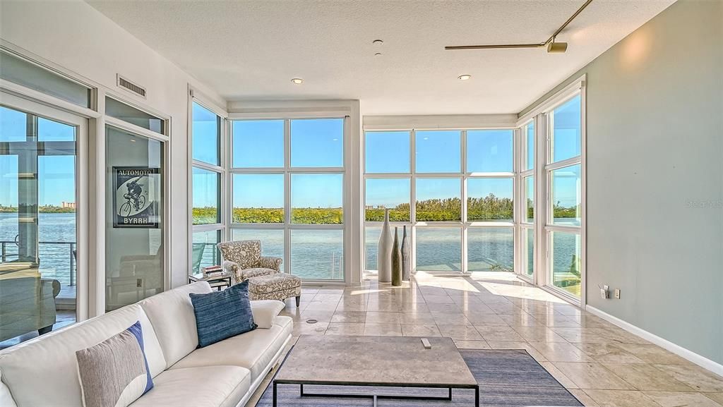 9137 Midnight Pass Road, Sarasota, Florida, is designed by the original owner and architect, Tony Ngai, and features expansive bay views from north to south on a quiet stretch.