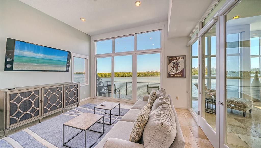9137 Midnight Pass Road, Sarasota, Florida, is designed by the original owner and architect, Tony Ngai, and features expansive bay views from north to south on a quiet stretch.