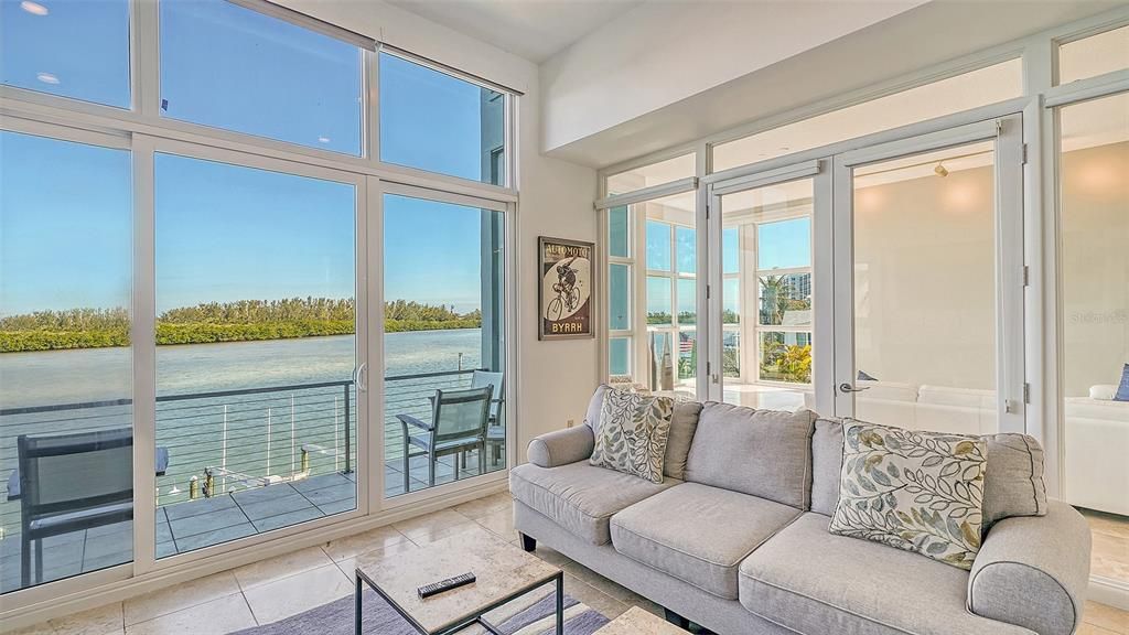 9137 Midnight Pass Road, Sarasota, Florida, is designed by the original owner and architect, Tony Ngai, and features expansive bay views from north to south on a quiet stretch.