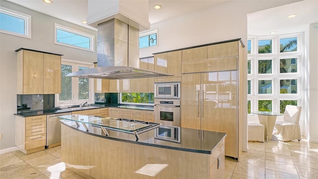 9137 Midnight Pass Road, Sarasota, Florida, is designed by the original owner and architect, Tony Ngai, and features expansive bay views from north to south on a quiet stretch.