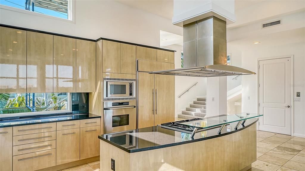 9137 Midnight Pass Road, Sarasota, Florida, is designed by the original owner and architect, Tony Ngai, and features expansive bay views from north to south on a quiet stretch.