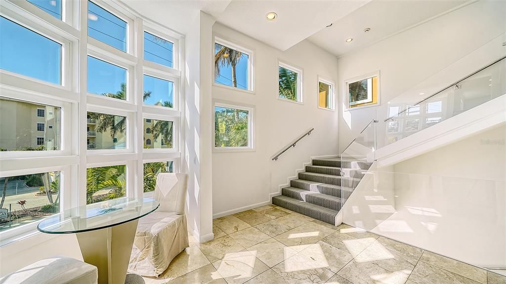 9137 Midnight Pass Road, Sarasota, Florida, is designed by the original owner and architect, Tony Ngai, and features expansive bay views from north to south on a quiet stretch.