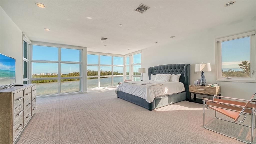 9137 Midnight Pass Road, Sarasota, Florida, is designed by the original owner and architect, Tony Ngai, and features expansive bay views from north to south on a quiet stretch.