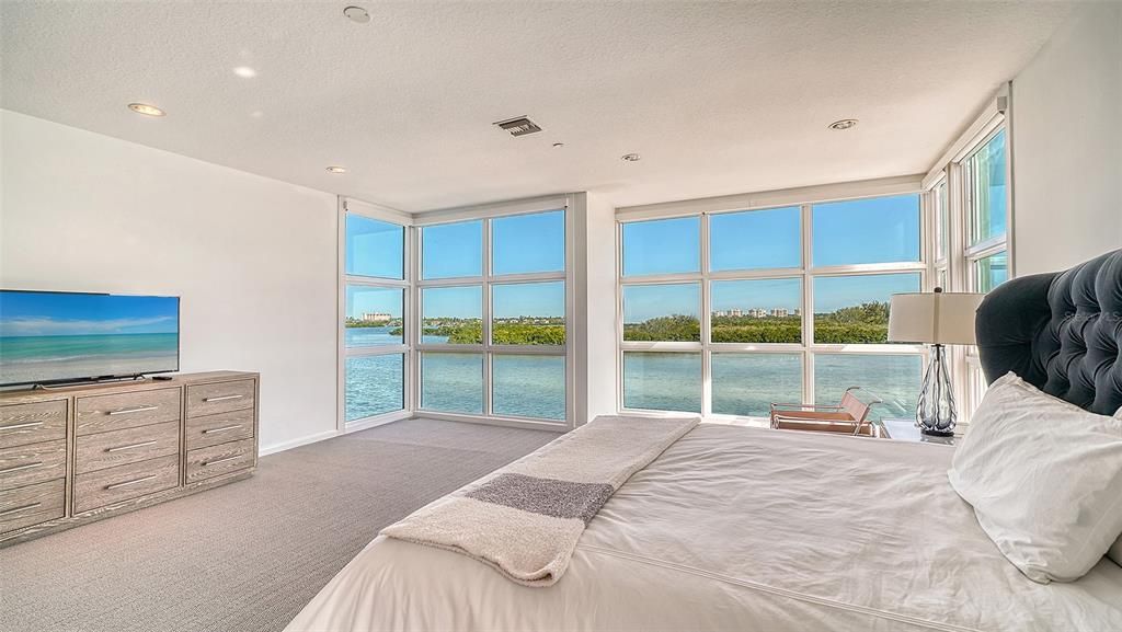 9137 Midnight Pass Road, Sarasota, Florida, is designed by the original owner and architect, Tony Ngai, and features expansive bay views from north to south on a quiet stretch.