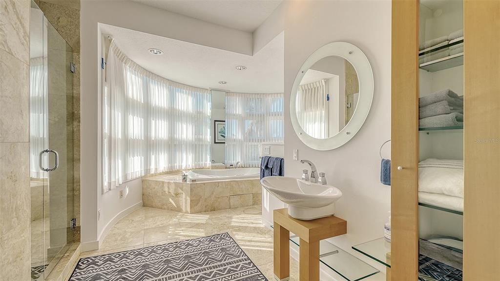 9137 Midnight Pass Road, Sarasota, Florida, is designed by the original owner and architect, Tony Ngai, and features expansive bay views from north to south on a quiet stretch.