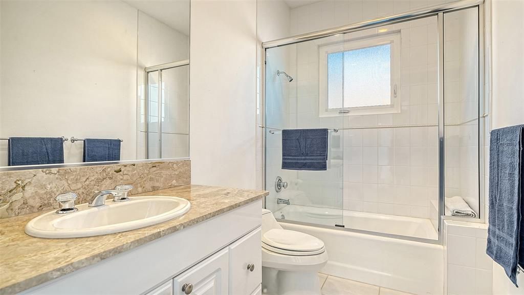 9137 Midnight Pass Road, Sarasota, Florida, is designed by the original owner and architect, Tony Ngai, and features expansive bay views from north to south on a quiet stretch.