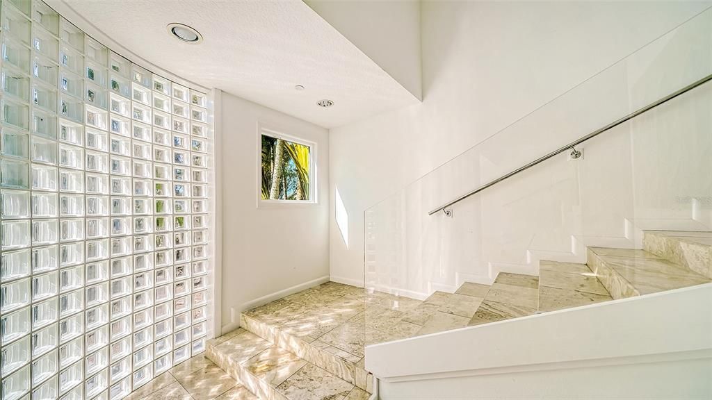 9137 Midnight Pass Road, Sarasota, Florida, is designed by the original owner and architect, Tony Ngai, and features expansive bay views from north to south on a quiet stretch.