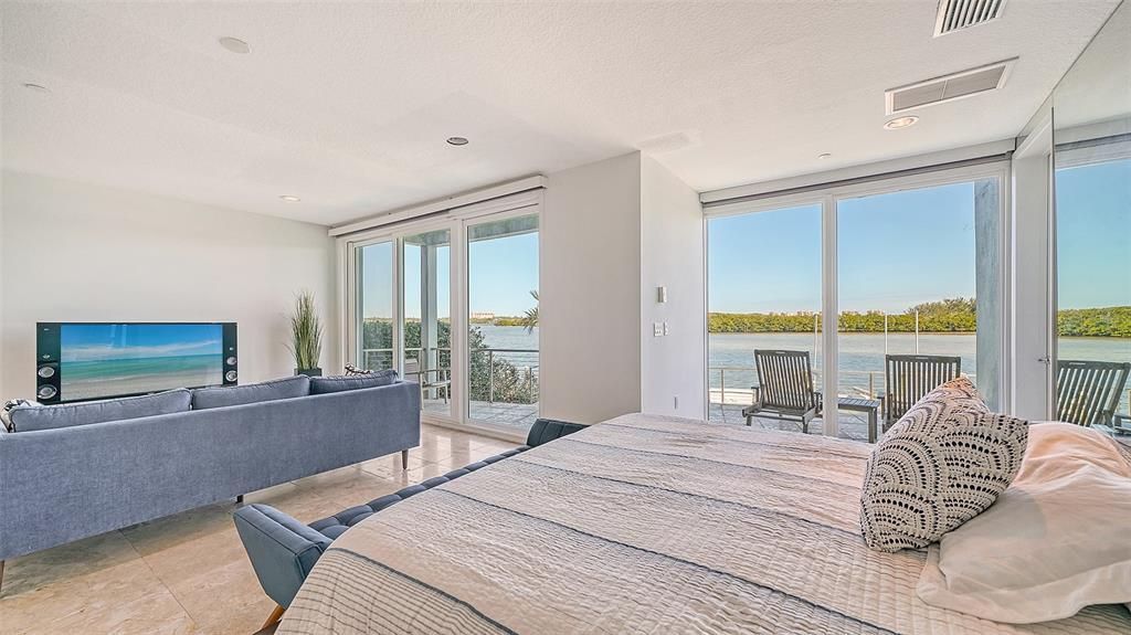 9137 Midnight Pass Road, Sarasota, Florida, is designed by the original owner and architect, Tony Ngai, and features expansive bay views from north to south on a quiet stretch.