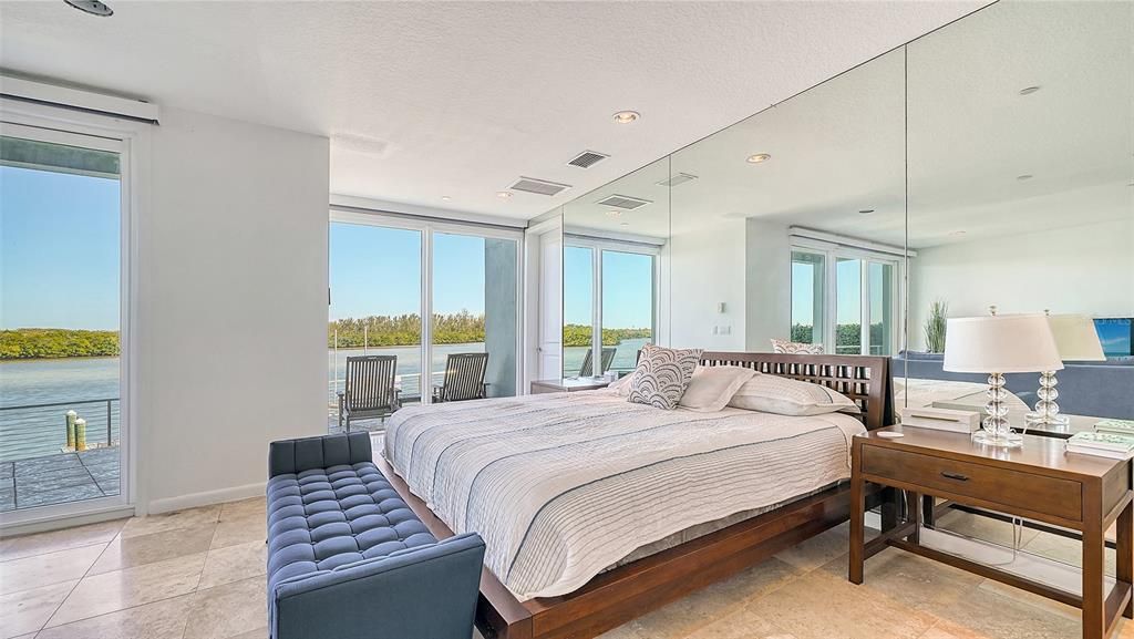 9137 Midnight Pass Road, Sarasota, Florida, is designed by the original owner and architect, Tony Ngai, and features expansive bay views from north to south on a quiet stretch.