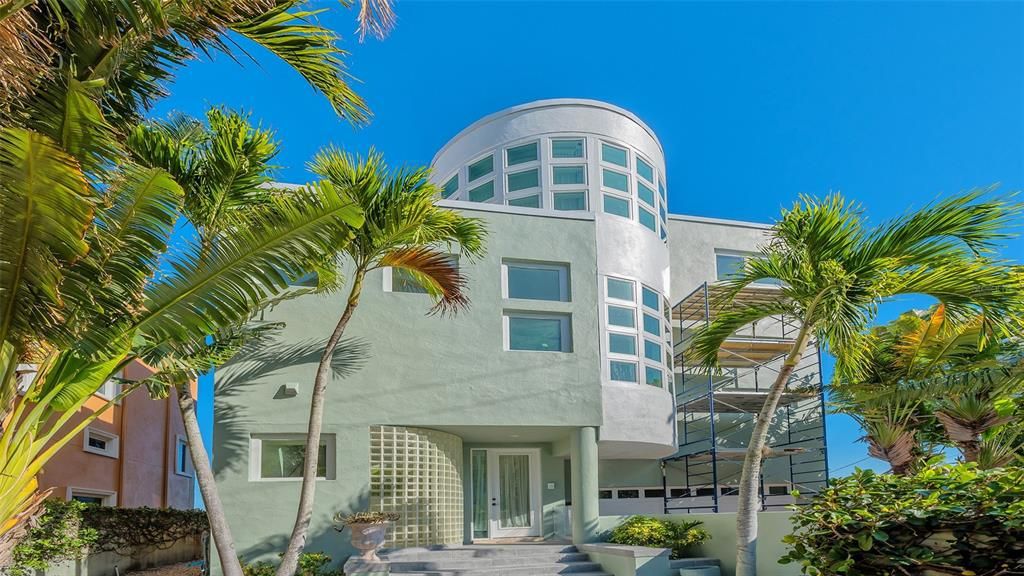 9137 Midnight Pass Road, Sarasota, Florida, is designed by the original owner and architect, Tony Ngai, and features expansive bay views from north to south on a quiet stretch.