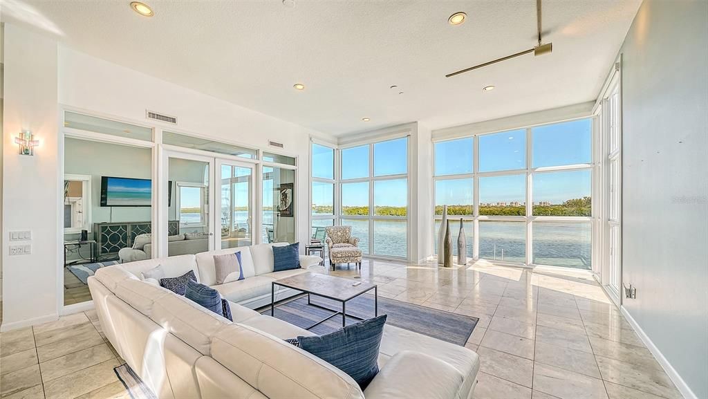 9137 Midnight Pass Road, Sarasota, Florida, is designed by the original owner and architect, Tony Ngai, and features expansive bay views from north to south on a quiet stretch.