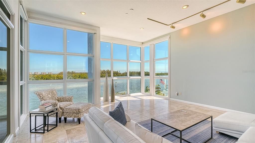 9137 Midnight Pass Road, Sarasota, Florida, is designed by the original owner and architect, Tony Ngai, and features expansive bay views from north to south on a quiet stretch.