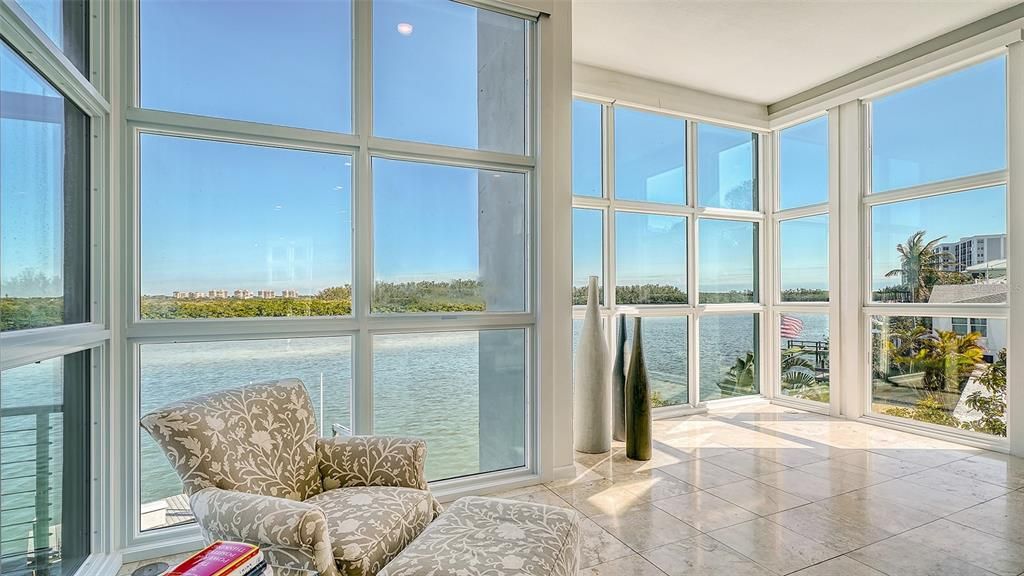 9137 Midnight Pass Road, Sarasota, Florida, is designed by the original owner and architect, Tony Ngai, and features expansive bay views from north to south on a quiet stretch.