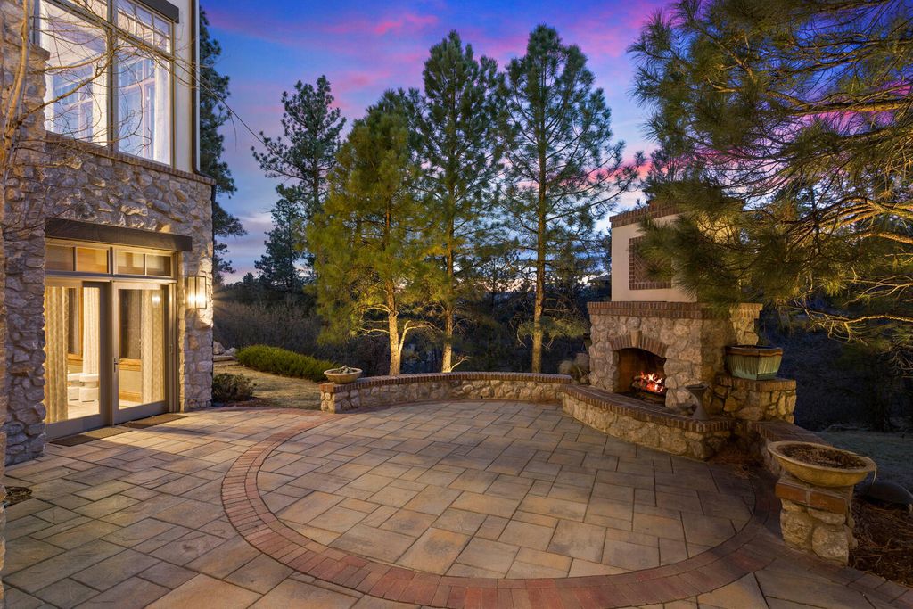 4 Eagle Pointe Lane, Castle Rock, Colorado is a a stunning renovation of a 2003 Trillium Home with the sweeping layout, along with dramatic wall and ceiling treatments, immaculate wood features, multiple fireplaces, and high-end designer finishes.