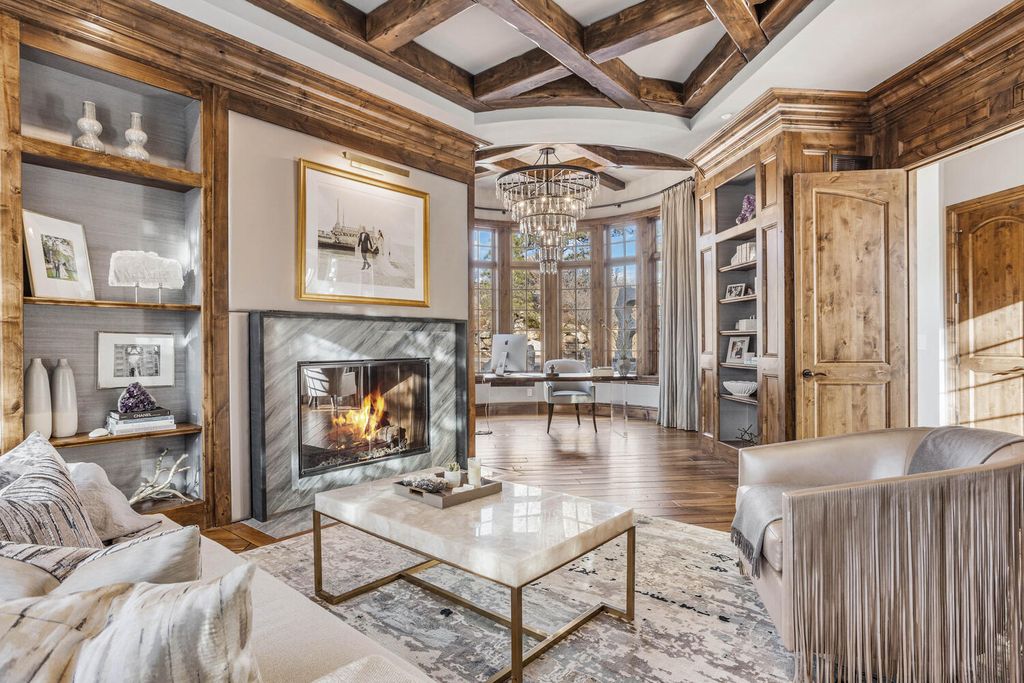 4 Eagle Pointe Lane, Castle Rock, Colorado is a a stunning renovation of a 2003 Trillium Home with the sweeping layout, along with dramatic wall and ceiling treatments, immaculate wood features, multiple fireplaces, and high-end designer finishes.